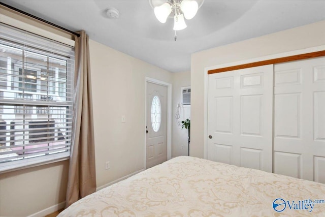 6304 Cedar Point Dr, Huntsville, AL 35810 - bedroom featuring multiple windows, a closet, baseboards, and a ceiling fan
