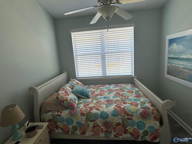 bedroom featuring baseboards and a ceiling fan