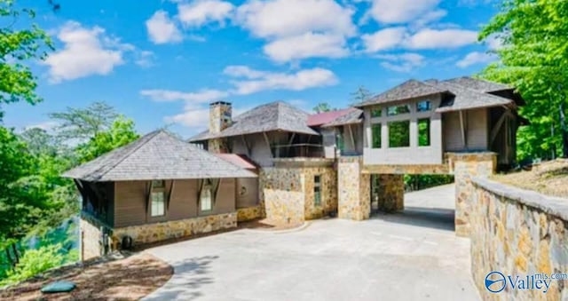 119 County Road 2112, Bremen, AL 35033 - view of front of property with stone siding, concrete driveway, and a carport