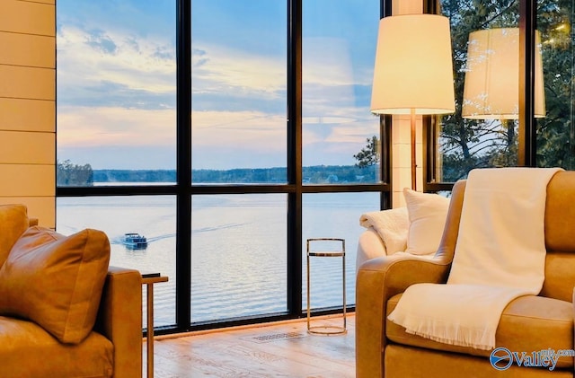 119 County Road 2112, Bremen, AL 35033 - sitting room with a water view, a wall of windows, and wood finished floors