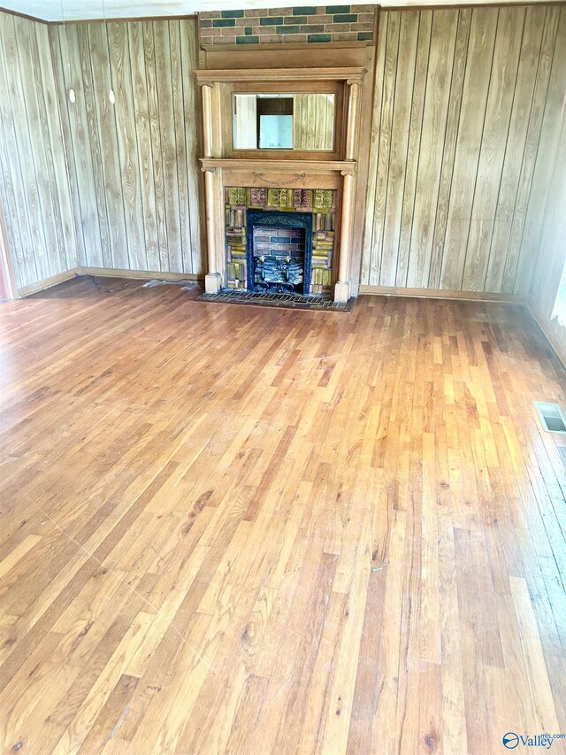 unfurnished living room with hardwood / wood-style floors