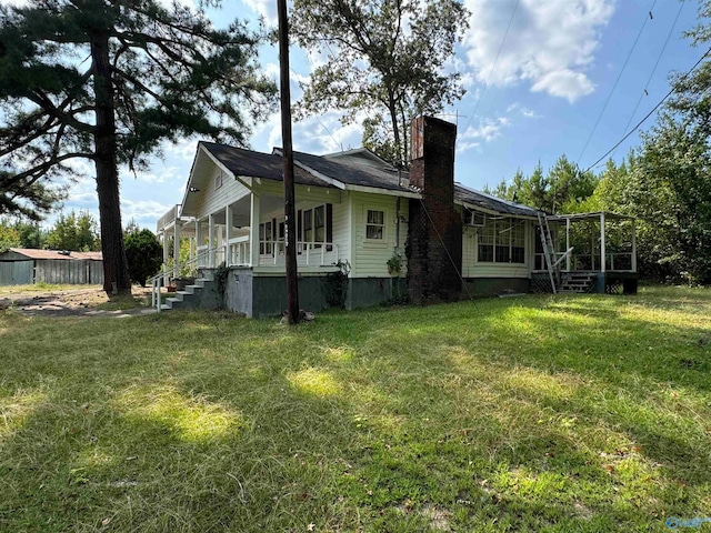 view of property exterior featuring a lawn and covered porch