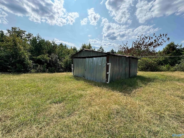 view of outdoor structure with a lawn