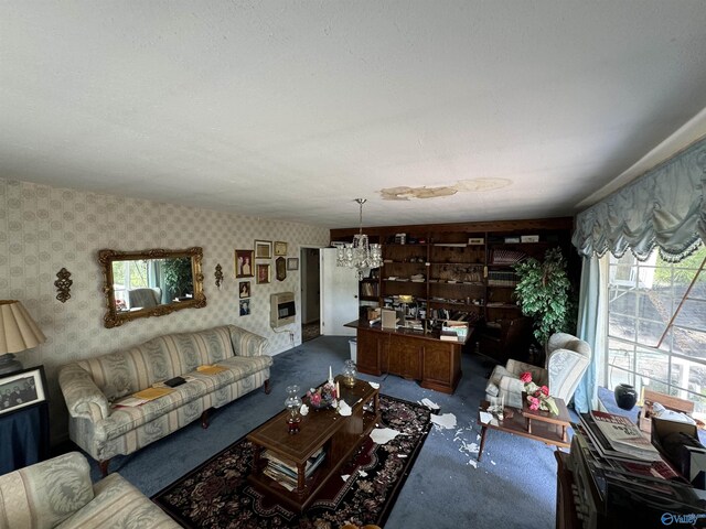 carpeted living room with wooden walls, a chandelier, and a textured ceiling