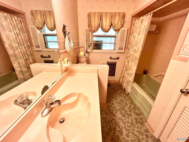 bathroom featuring vanity, tile patterned flooring, shower / bath combo, and tile walls