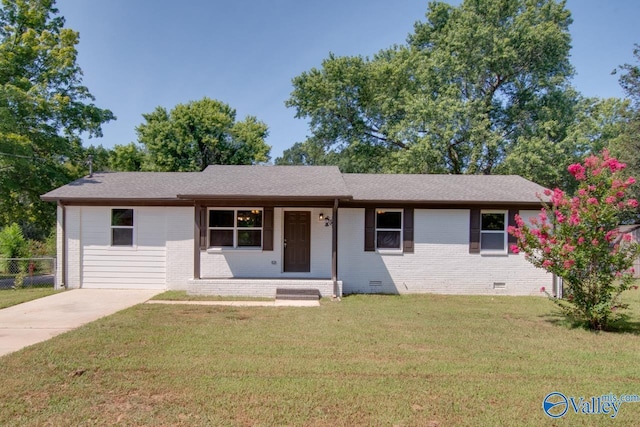 single story home with crawl space, brick siding, fence, and a front yard