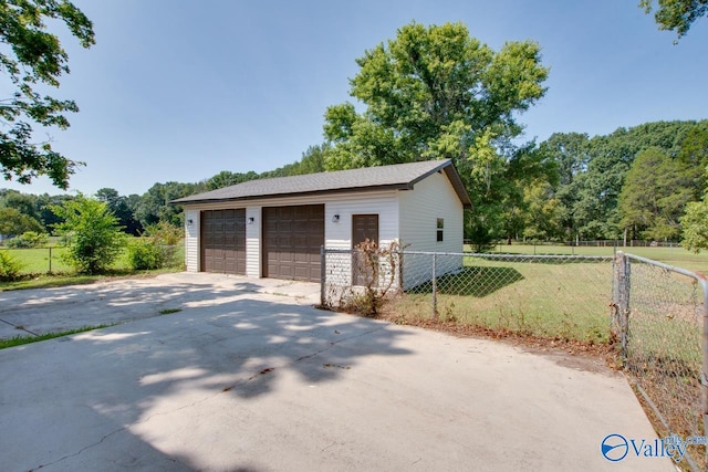 garage with a yard