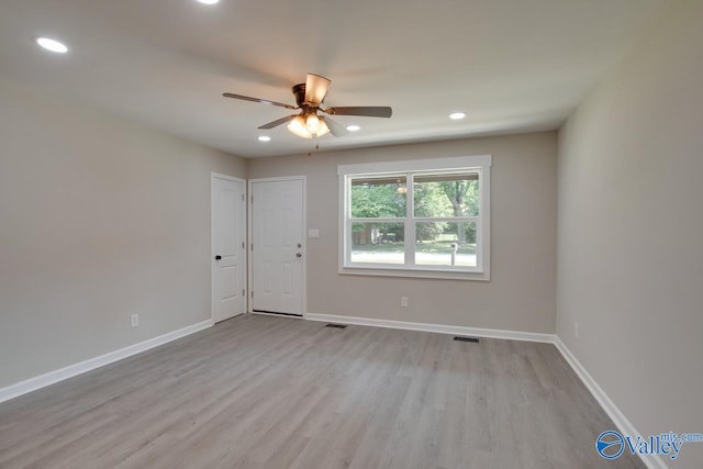 unfurnished bedroom featuring ceiling fan and light hardwood / wood-style flooring