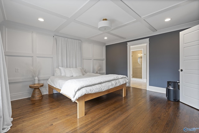 bedroom featuring crown molding, coffered ceiling, and dark wood-type flooring