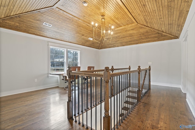 corridor featuring lofted ceiling, an inviting chandelier, wooden ceiling, ornamental molding, and dark hardwood / wood-style flooring