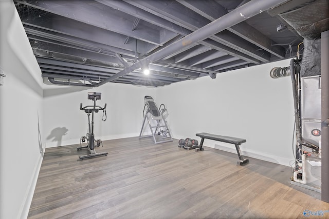 exercise area with hardwood / wood-style flooring