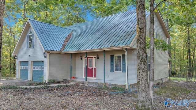 view of front of property with a garage and a porch