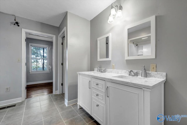 bathroom with vanity and tile patterned floors