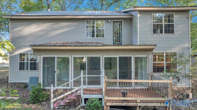 rear view of house with a sunroom