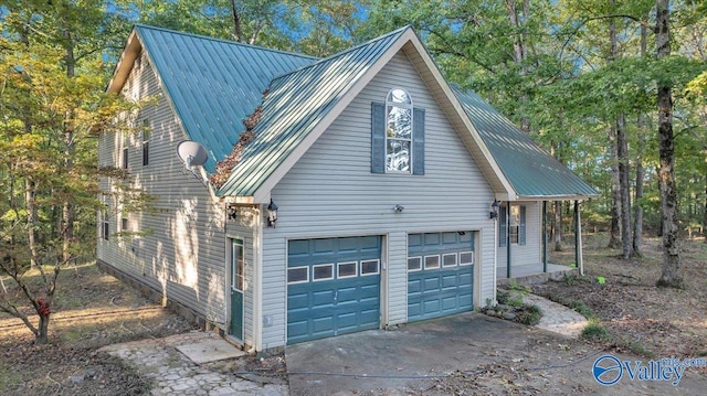 view of side of property featuring a garage