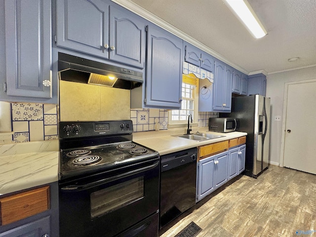 kitchen with blue cabinets, sink, tasteful backsplash, crown molding, and black appliances