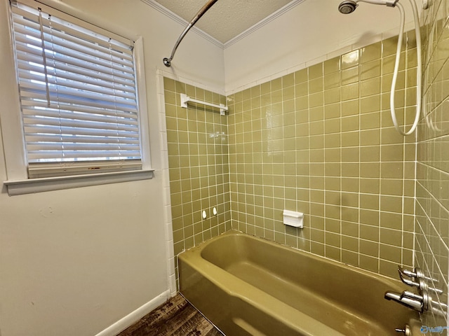 bathroom with tiled shower / bath combo, a textured ceiling, and hardwood / wood-style flooring