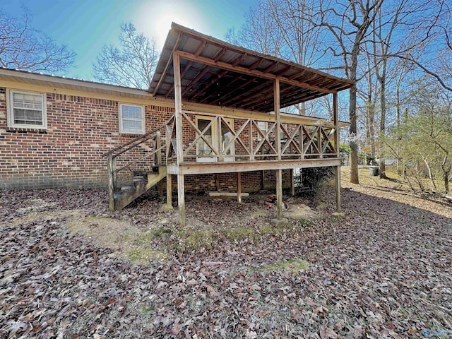 rear view of property with a deck