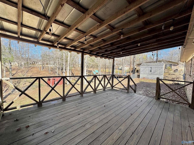 wooden terrace with a storage unit