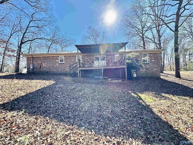 rear view of property with a deck