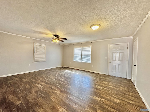 unfurnished room featuring ceiling fan, ornamental molding, dark hardwood / wood-style flooring, and a textured ceiling