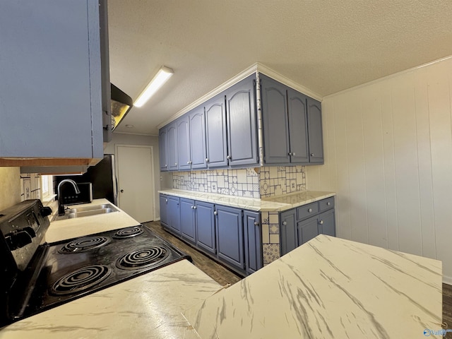 kitchen with sink, ornamental molding, black range with electric stovetop, blue cabinetry, and a textured ceiling