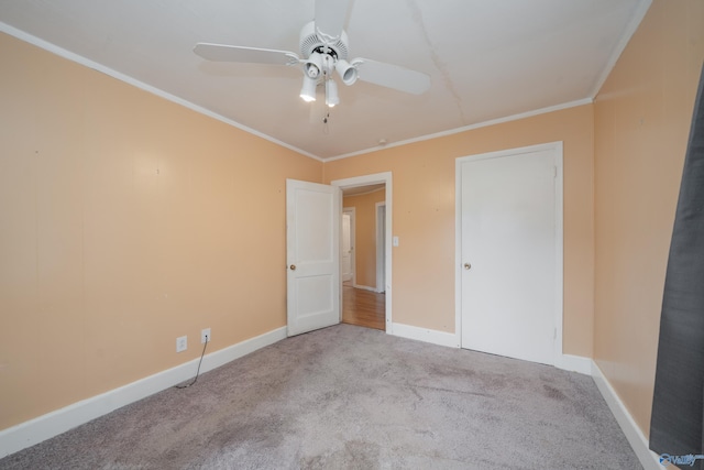 2116 Virginia Blvd NW, Huntsville, AL 35811 - unfurnished bedroom featuring carpet flooring, ornamental molding, and a ceiling fan