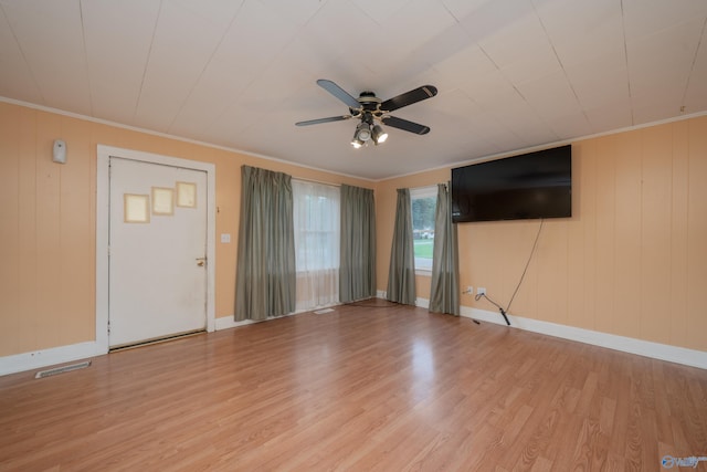2116 Virginia Blvd NW, Huntsville, AL 35811 - unfurnished living room featuring light wood-style flooring, a ceiling fan, and crown molding