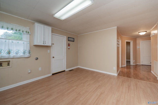 2116 Virginia Blvd NW, Huntsville, AL 35811 - spare room with light wood-style floors and ornamental molding