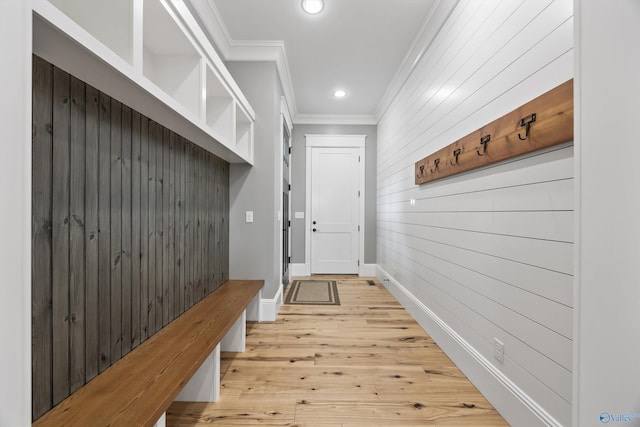 mudroom featuring crown molding and wood-type flooring