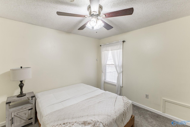 bedroom featuring baseboards, carpet, ceiling fan, and a textured ceiling