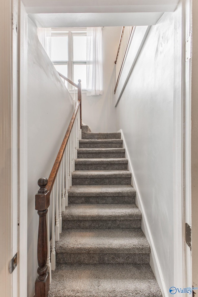 staircase with baseboards