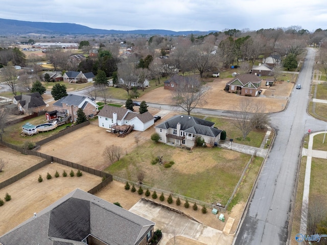 birds eye view of property with a mountain view and a residential view