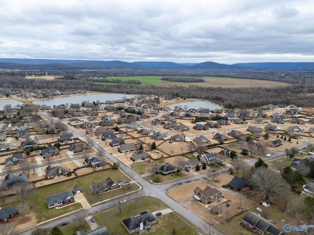 bird's eye view with a water view and a residential view