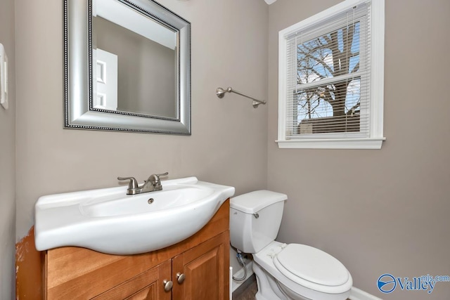 bathroom with vanity and toilet