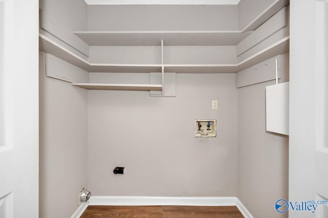 laundry room featuring dark hardwood / wood-style floors, washer hookup, and hookup for an electric dryer