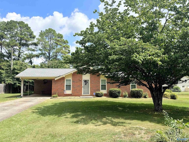 view of front of property with an attached carport, brick siding, driveway, and a front yard