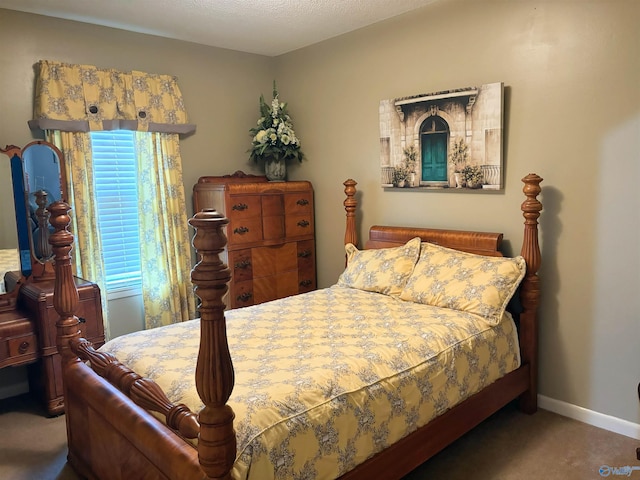 bedroom featuring carpet and baseboards