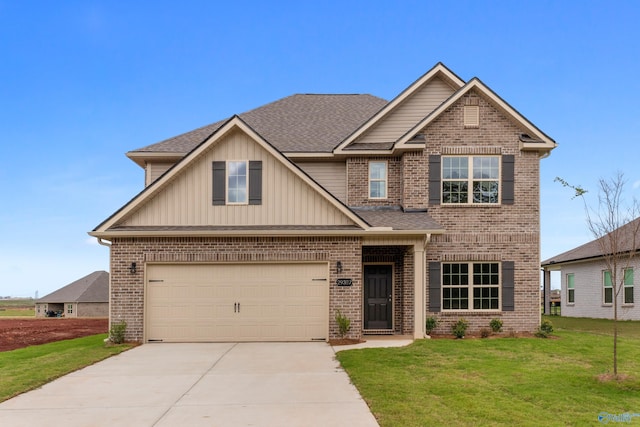 craftsman-style home featuring brick siding, roof with shingles, an attached garage, a front yard, and driveway