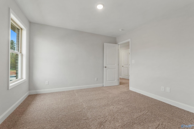 empty room featuring carpet flooring