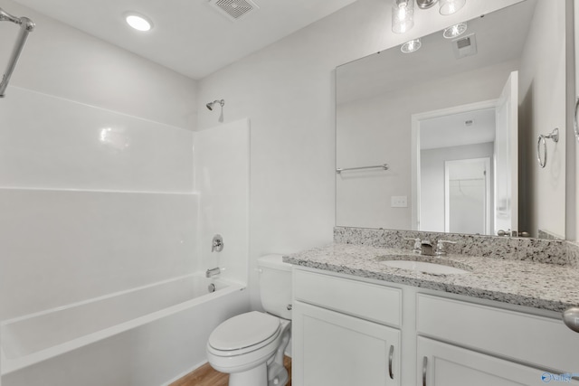 full bathroom with bathtub / shower combination, hardwood / wood-style floors, vanity, and toilet