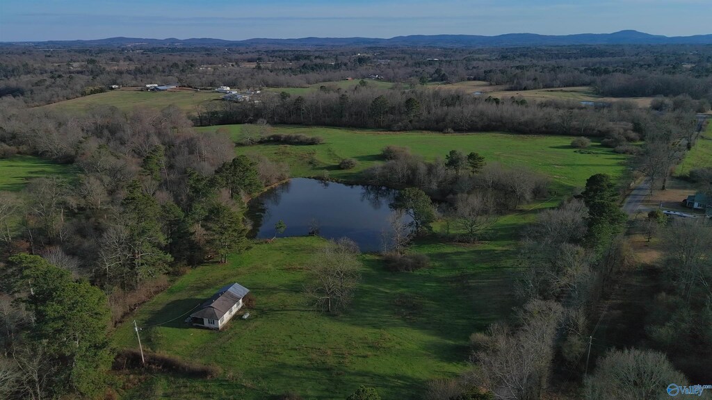 birds eye view of property featuring a water and mountain view