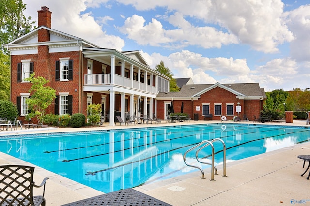 view of swimming pool with a patio