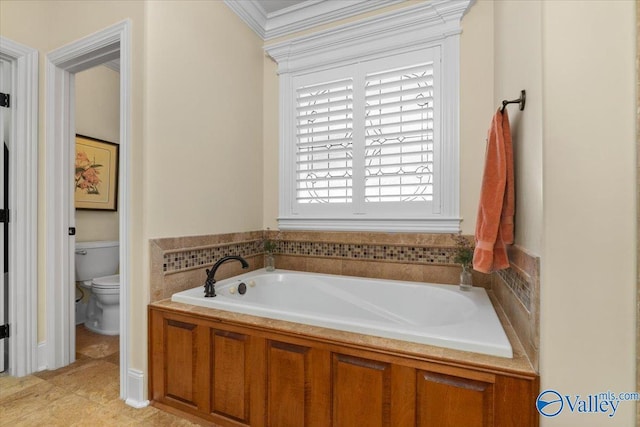 full bath with a garden tub, crown molding, toilet, and tile patterned floors