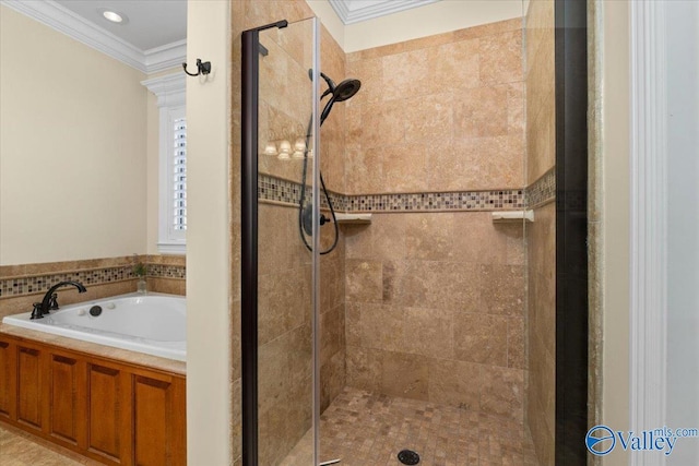 bathroom with ornamental molding, a stall shower, and a garden tub