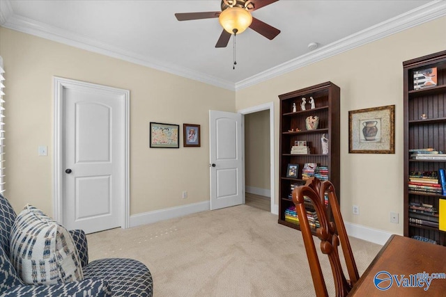 interior space featuring light carpet, baseboards, ornamental molding, and a ceiling fan