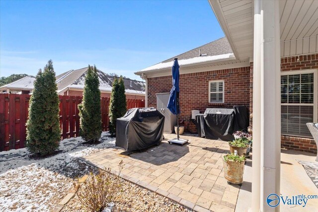 view of patio featuring fence and grilling area