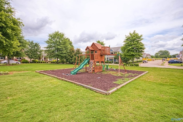 community jungle gym with a yard