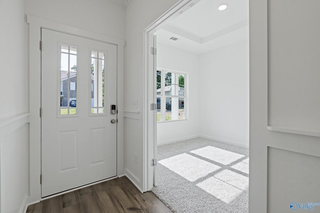 entrance foyer with recessed lighting, dark wood finished floors, visible vents, and baseboards