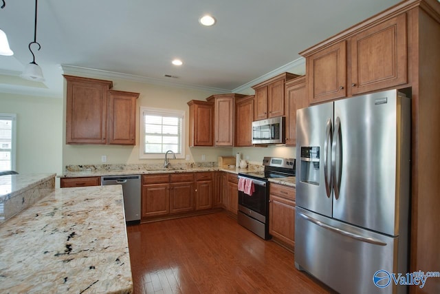 kitchen featuring stainless steel appliances, sink, ornamental molding, dark hardwood / wood-style floors, and pendant lighting